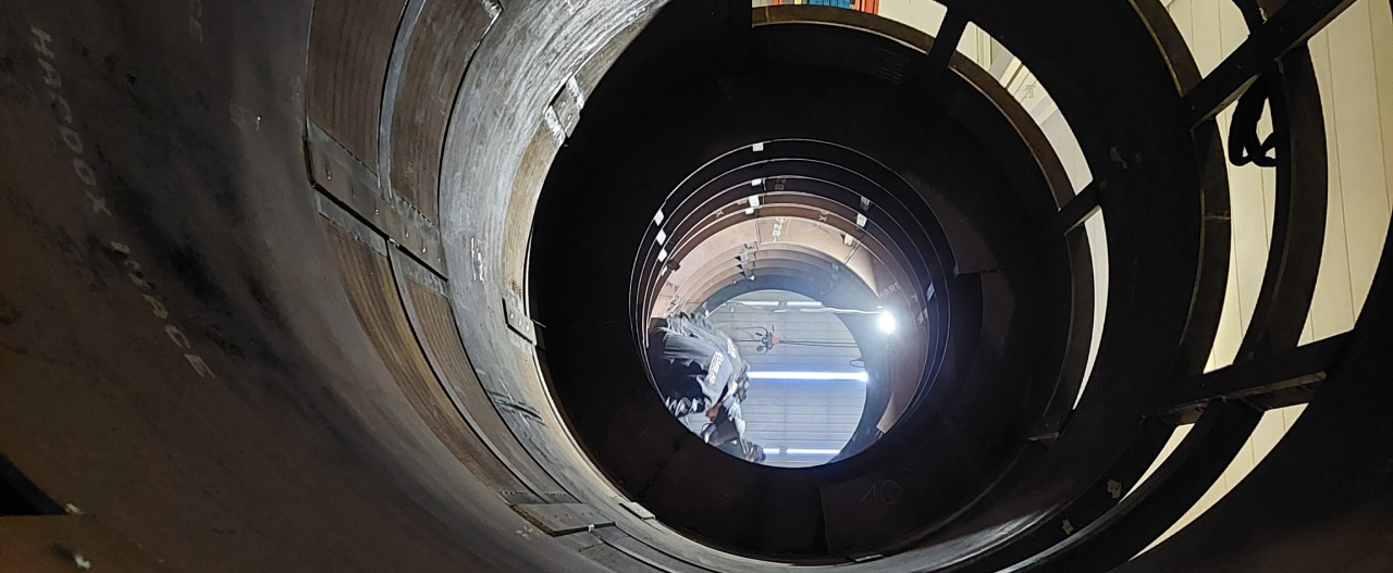 Looking into the chute at a recyclcing plant, with the chute walls made in Hardox® HiAce corrosion resistant steel.