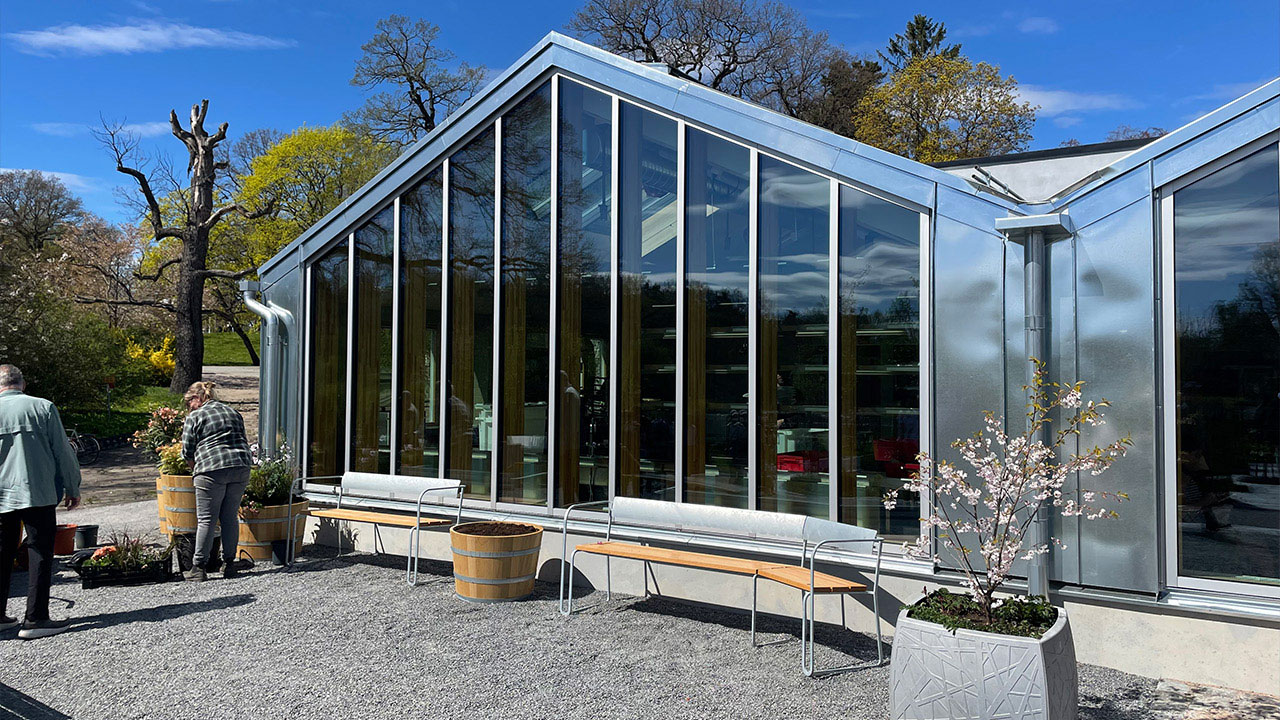 A gable of a house at Rosendals Trädgårdar with a full glass wall.