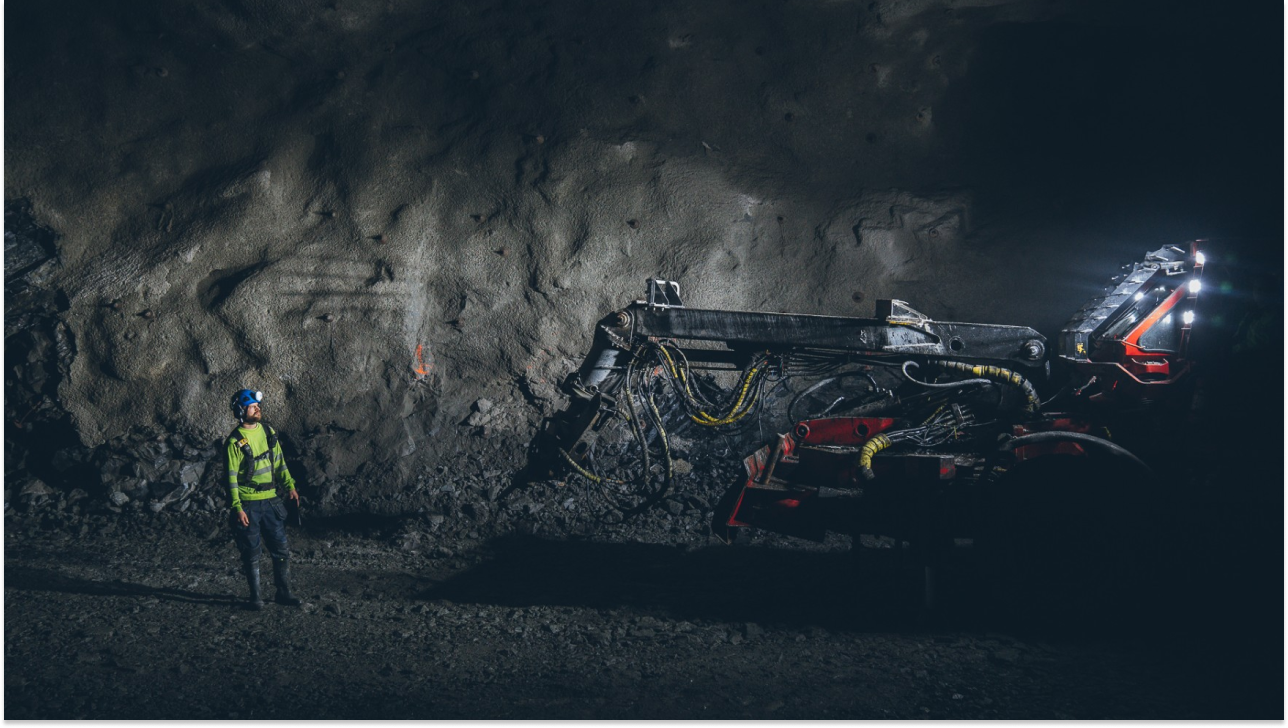 Man standing in front of rockbolt equipment